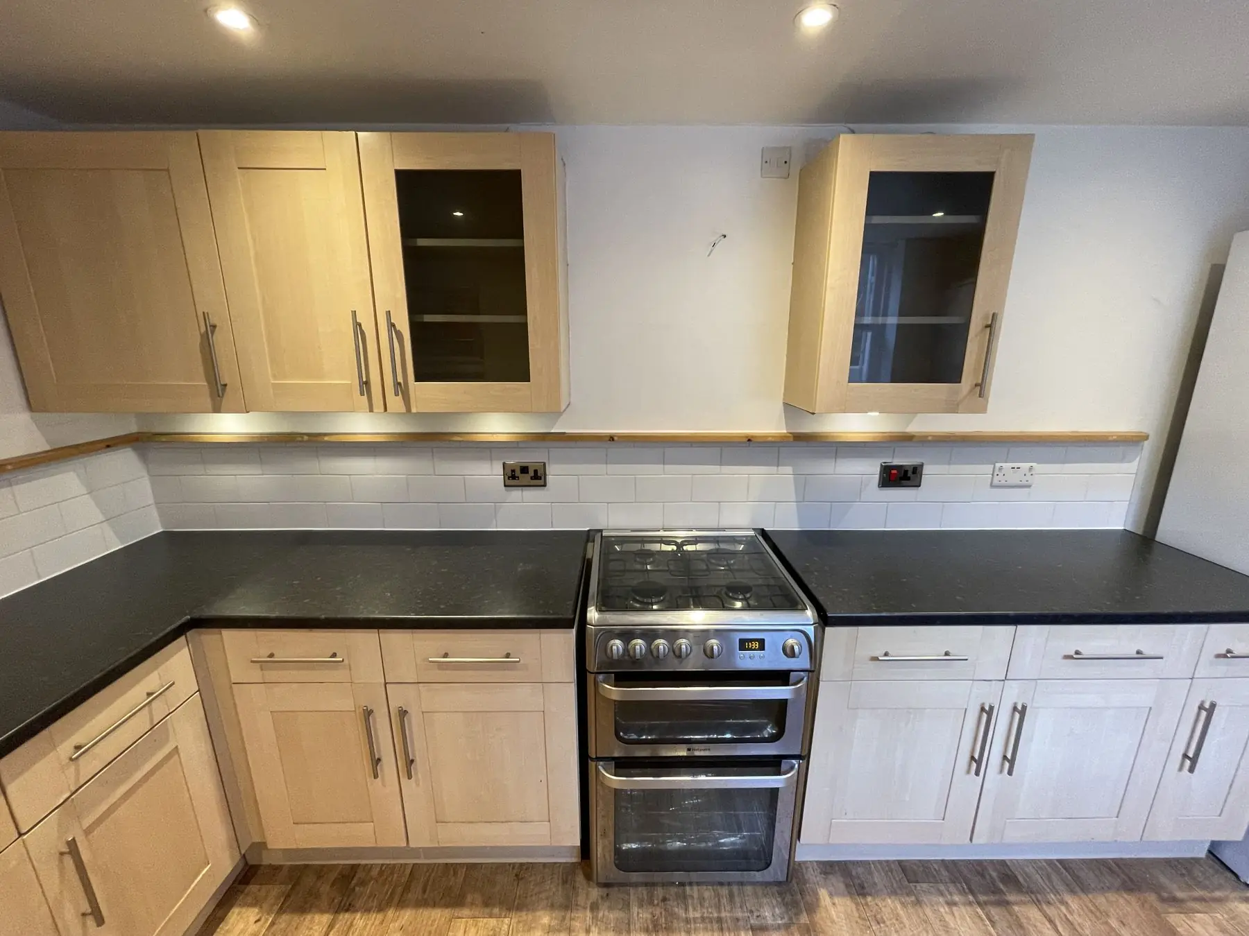 Rental kitchen with new black worktops fitted by Aveiro