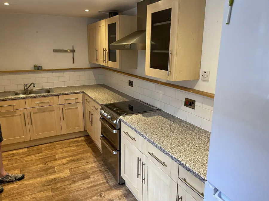 Kitchen before with old granite-effect worktops