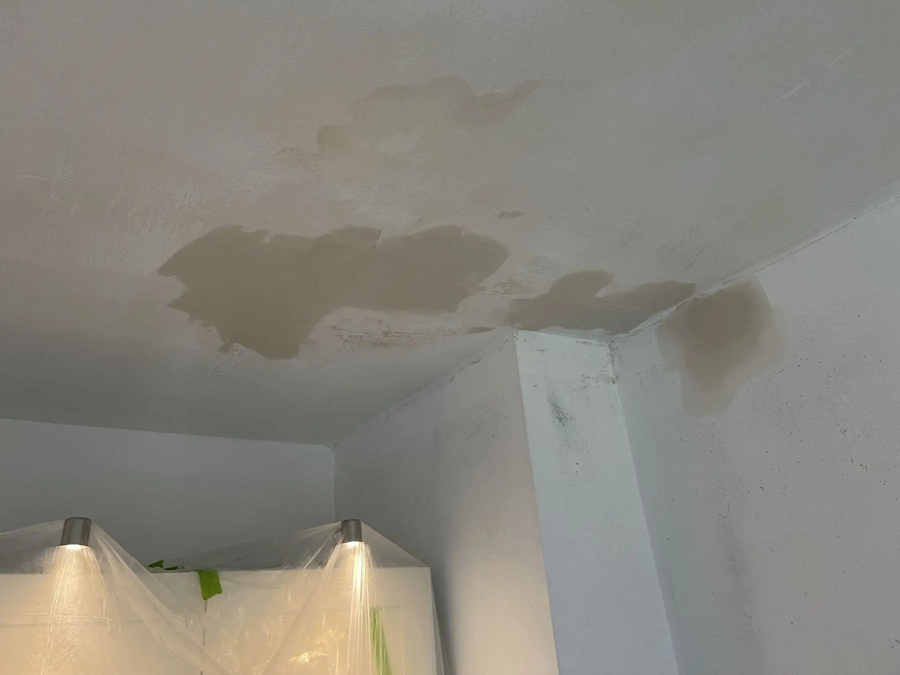 Water-stained ceiling during a leak investigation