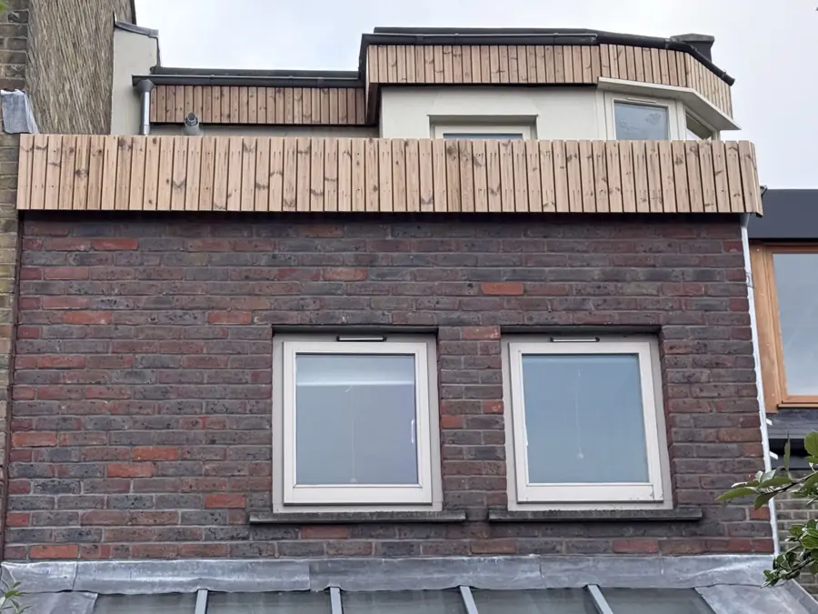 New timber cladding at roof level
